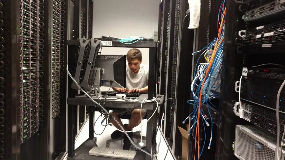 Ben installing servers at MIT data center